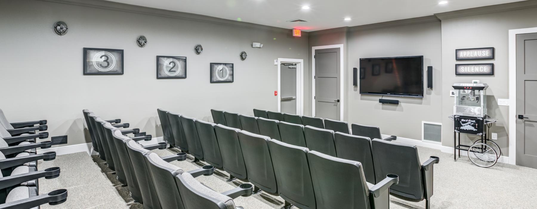 a room with a tv and chairs