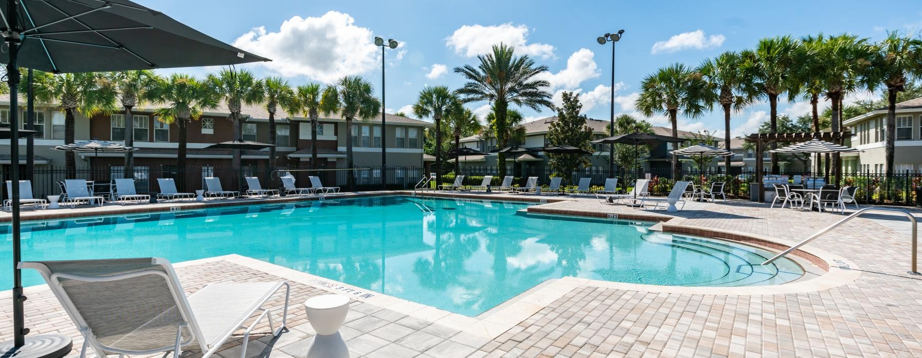 a pool with chairs around it
